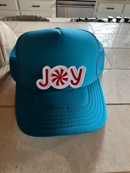 Turquoise hat with red joy patch
